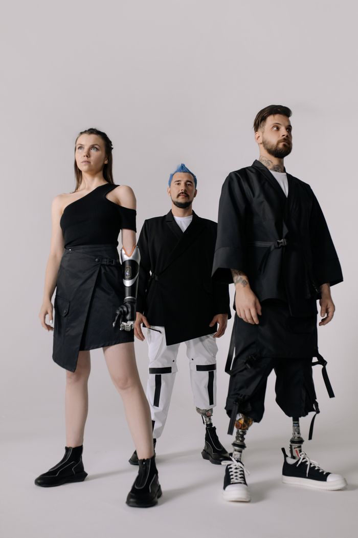 Models showcase modern prosthetics in stylish, futuristic clothing.